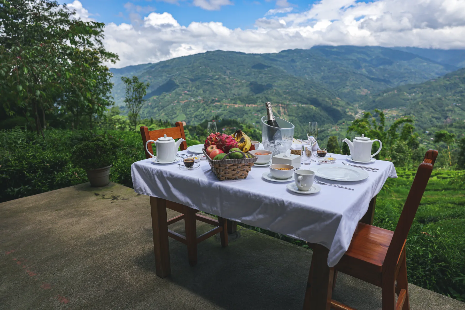 Breakfast for two on a terrace overlooking the green hills
