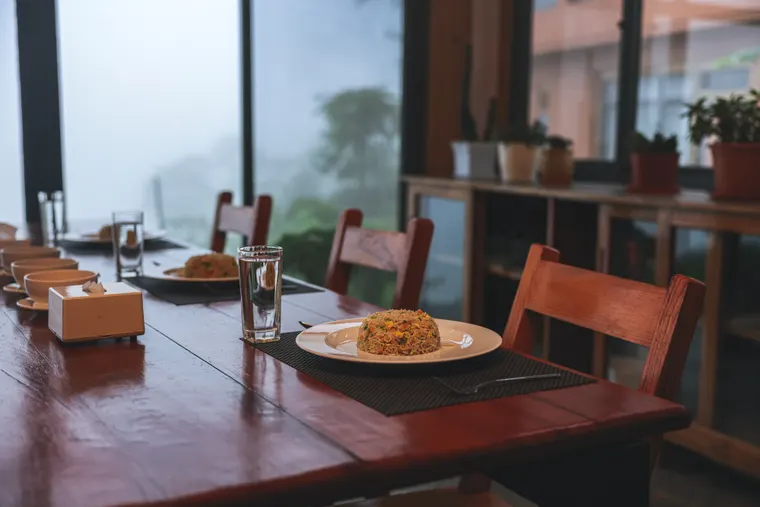 A table for two beside the large kitchen windows