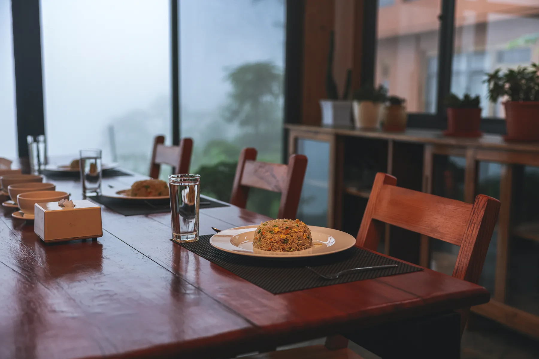 A table for two beside the large kitchen windows