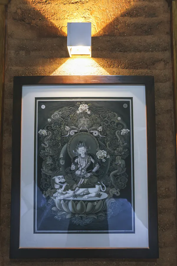 Soft wall lighting above traditional framed artwork