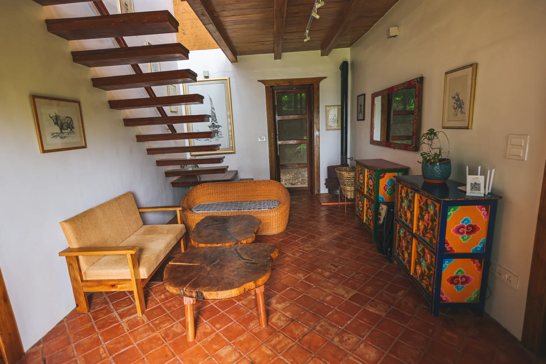 Shared seating with timber stairs and a colourful painted cabinet