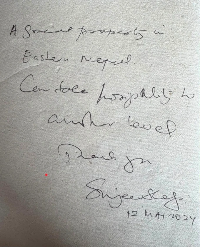 Original handwritten guest note praising the property and hospitality in eastern Nepal